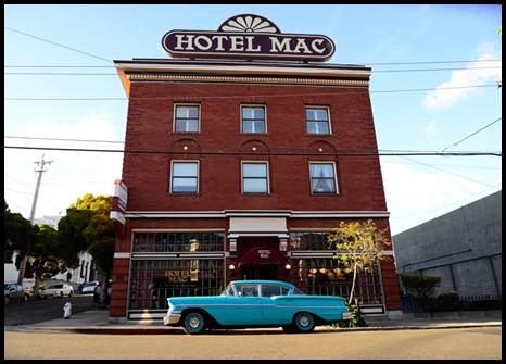 Description: Description: Hotel Mac with Vintage Car
